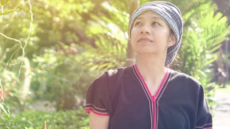 Asian ethnic woman with native dress smile at her mornign organic rice fieldの写真素材