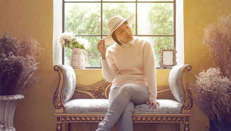 Asian woman sit at window sun light luxury trip Summer Europe