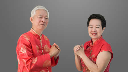 Asian senior Chinese new year gesture celebrationの写真素材