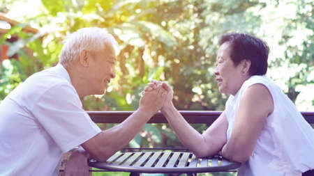 Asian senior couple play together happy game of relationship togetherの写真素材