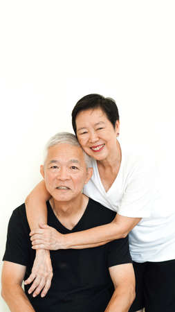 Asian senior couple happy together expression on white backgroundの写真素材