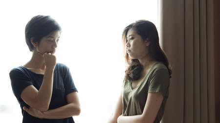 Asian mixed race woman friends listening to problemsの写真素材