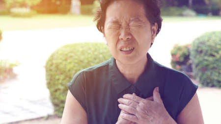 Asian senior woman chest pain heart attack strokeの写真素材