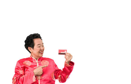 Asian senior woman shopping credit card Chinese New Year discount dealの写真素材