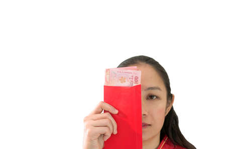 Unhappy Chiense woman and red envelop with money New Yearの写真素材
