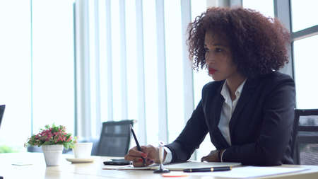 African young business woman working on strategy modern officeの写真素材