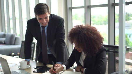 African and Hispanic colleague high five closing business deal