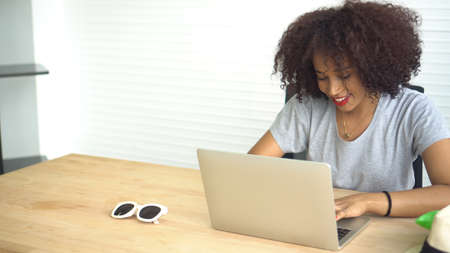 African woman working with laptop from home serious entrepreneurの写真素材