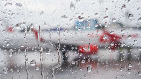 Rain on blur plane window low season bad for airline businessの写真素材