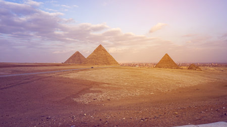 Pyramids of Giza with city view background