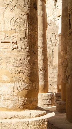 Luxor Egypt Karnak temple sandstone craved hieroglphic wall and column pharoah and anceint storyの写真素材
