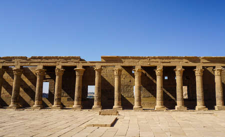Beautfil Philae temple Aswan Egypt architecture hieroglyphic and column in  sunny blue sky