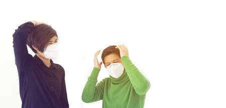 Two Asian diversity friends mask frustrated angry and worry from corona virus covid-19