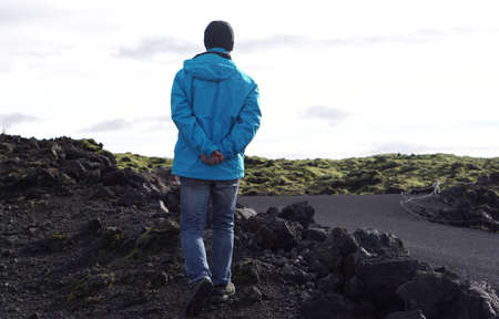 Asian man in Iceland wearing blue jacket in Summer outdoorの写真素材