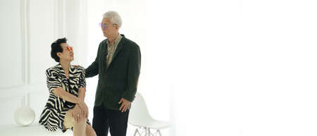 Asian senior elder hipster couple wearing stylish fashion winter dress white background with copy spaceの写真素材