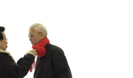 Asian senior elder couple take care of each other wearing warm winter cloth for healthの写真素材