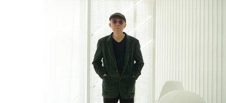 Asian senior man model in fashion and sunglasses dress up white backgroundの写真素材