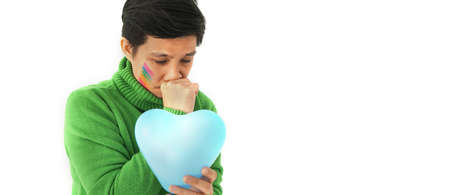 Asian ethnic LGBT tomboy sad expression disappointed in love and relationship problemsの写真素材