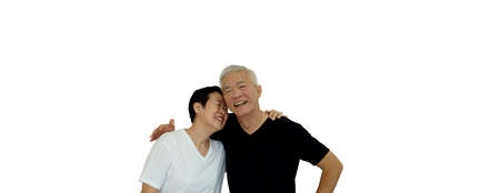 Asian senior couple hugging studio shot banner with copu spaceの写真素材
