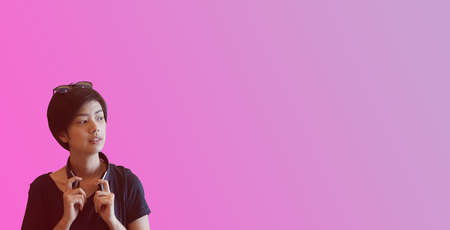 Cool short hair Asian woman young adult life style headphone sunglasses thinking with copy spaceの写真素材