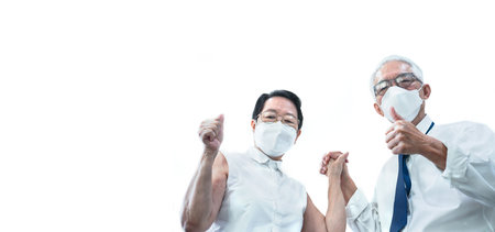 Asian senior elderly couple encourage business planning on  fight go through pandemicの写真素材