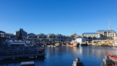 Cape Town, South Africa Victoria and Alfred waterfront promenade port with table mountain and ferris wheel skyline landmark attraactionのeditorial素材