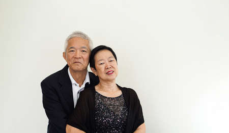 Asian senior elderly couple happy business owner hugging each other smileの写真素材