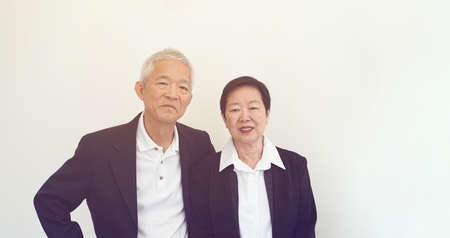 Asian senior elderly couple happy business owner hugging each other smileの写真素材