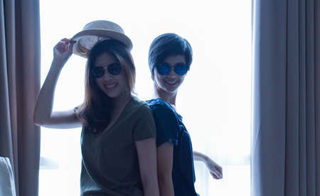 two Asian women casual summer fashion relax and fun together at homeの写真素材