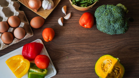 Flay lay food cooking vegetable broccoli egg pepper pea garlic background on wood texture text copy spaceの写真素材