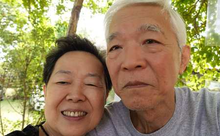 Asian senior elder couple taking selfie together fun retire trip together lifestyleの写真素材
