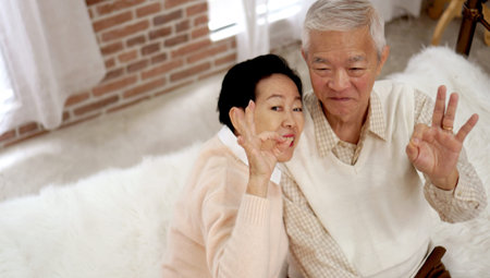 Asian older senior couple in rich wealthy house interior