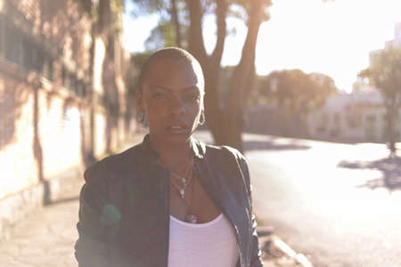 Black woman with short hair on an urban backgroundの写真素材