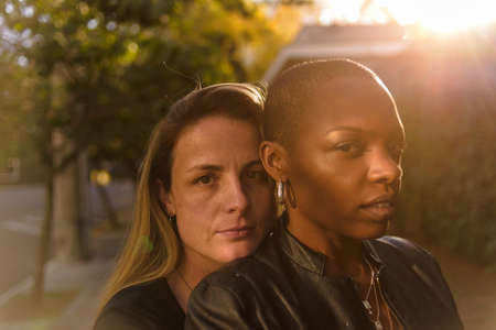 Romantic and fun portrait of a young lgbt couple on an urban backgroundの写真素材