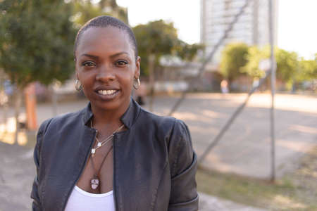Black woman with short hair on an urban backgroundの写真素材