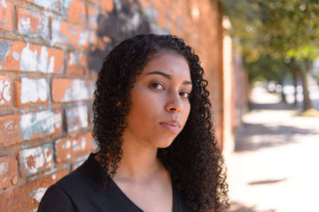 Black woman on urban background in casual clothing