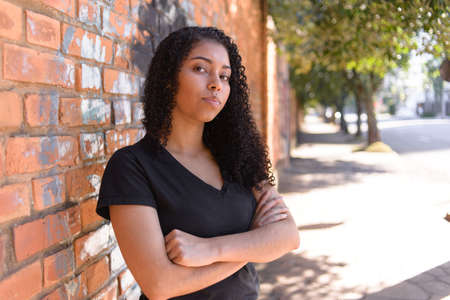 Black woman on urban background in casual clothingの写真素材