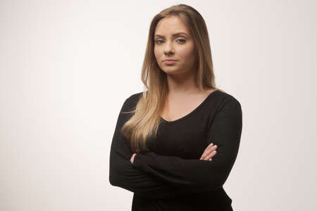 Portrait of white caucasian woman angry disappointed furious in white background studio