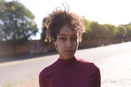 Black young woman portrait outdoors in urban landscape