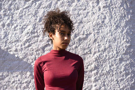 African American young woman portrait outdoors in urban landscapeの写真素材