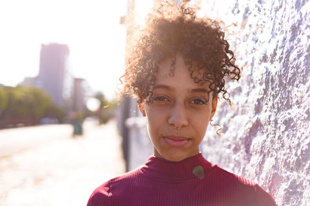 African American young woman portrait outdoors in urban landscapeの写真素材
