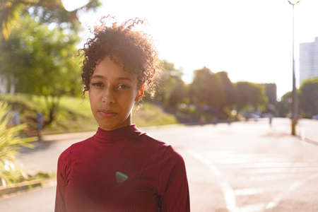 African American young woman portrait outdoors in urban landscapeの写真素材