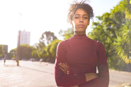 African American young woman portrait outdoors in urban landscapeの写真素材