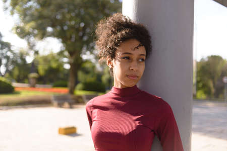 Young beautiful african american woman outside in urban background