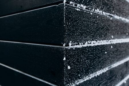 Snow on black wallの写真素材