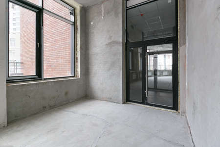 empty pure commercial office building undecorated in gray colors.open space office