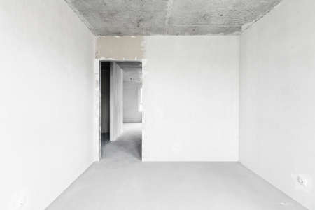 Interior of empty warehouse with empty racksの写真素材