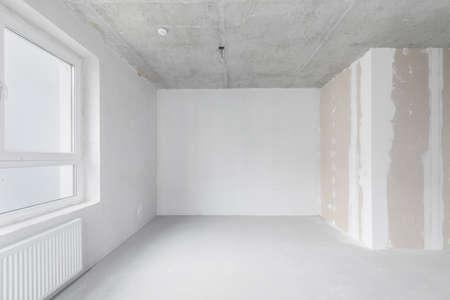 Interior of empty warehouse with empty racksの写真素材