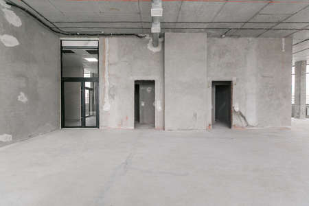 Interior of empty warehouse with empty racksの写真素材