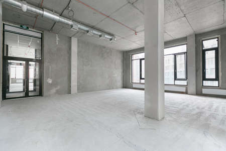 empty pure commercial office building undecorated in gray colors.open space office